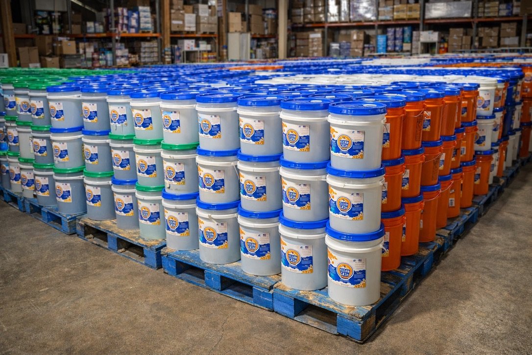 Clean Cash laundry detergent buckets on warehouse pallet